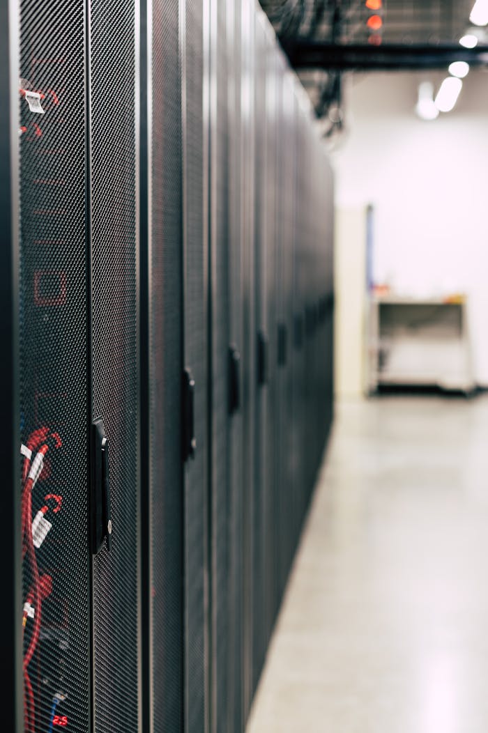 about-us High-tech data center featuring multiple server racks with advanced equipment.